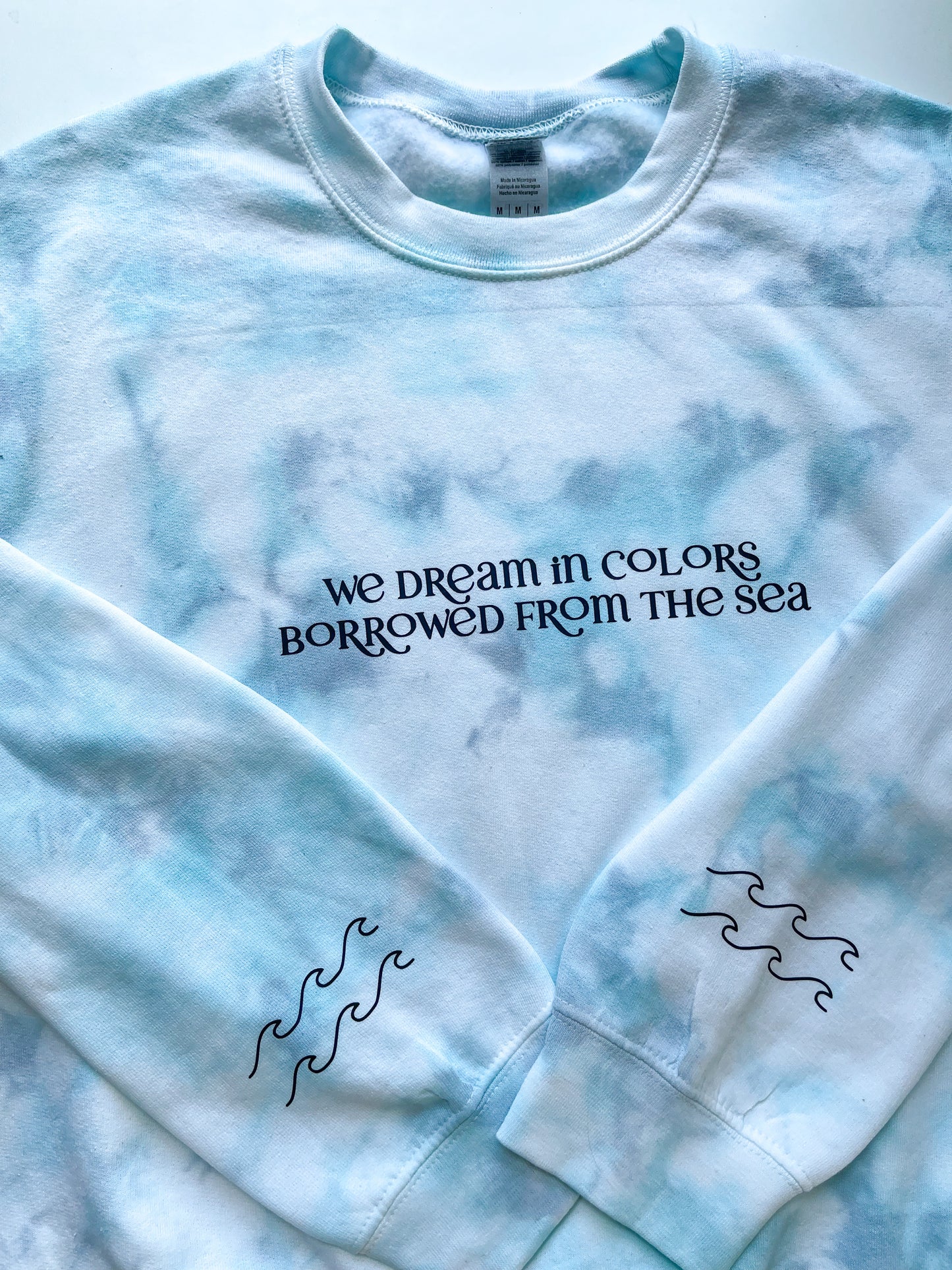 We dream in colors borrowed from the sea Tie Dye Sweatshirt